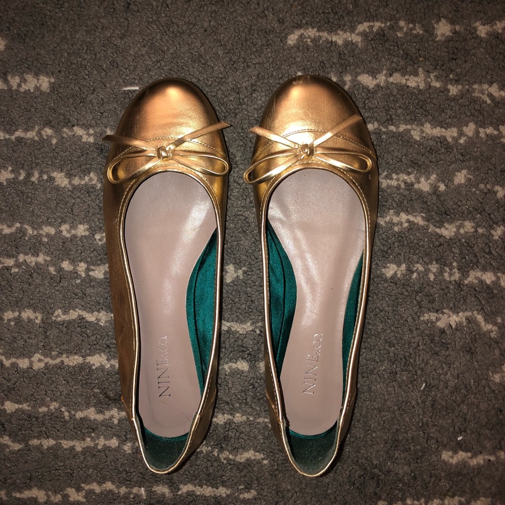 Gold metallic flats.